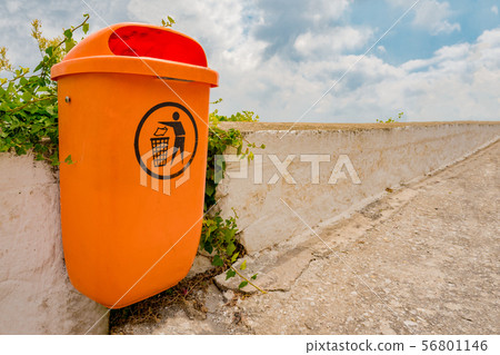 Organge small bin for garbage disposal. Recycling concept. Reusable inorganic items. Trethink Organge small bin for garbage disposal. Recycling concept. Reusable inorganic items. Trethink 56801146