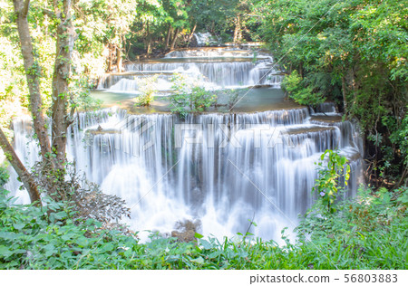 Waterfall flowing from the mountains. 56803883
