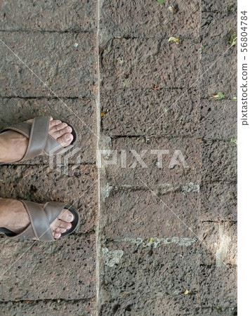 The feet of people standing on the stairs made of The feet of people standing on the stairs made of 56804784