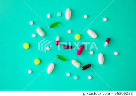 scattered various colored tablets in a blue-cyan 56809288