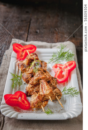 juicy meat-chicken skewers on wooden skewers on a juicy meat-chicken skewers on wooden skewers on a 56809304