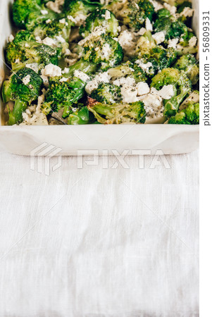 Chicken fillet and broccoli baked in cheese sauce 56809331