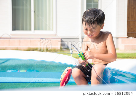 Children playing in the pool at home 56812094