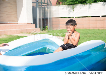 Children playing in the pool at home 56812095