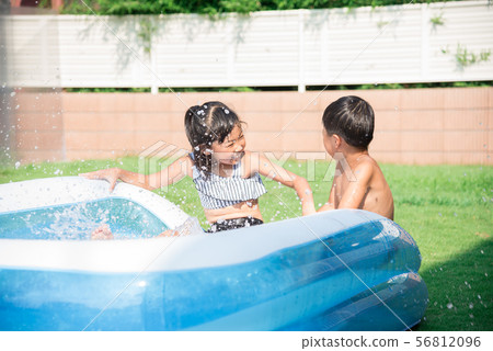 Children playing in the pool at home 56812096