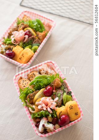Eating disposable box lunch Eating disposable box lunch 56812684