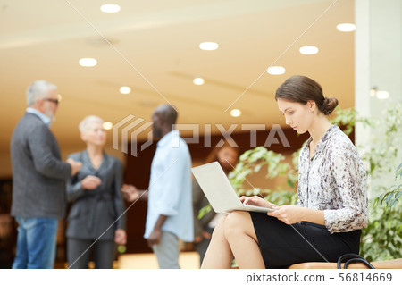 Young Businesswoman using Laptop 56814669