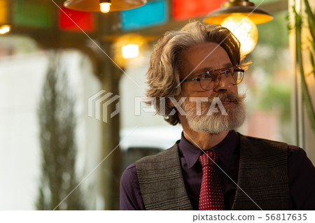 Thoughtful handsome man waiting for his friend. 56817635