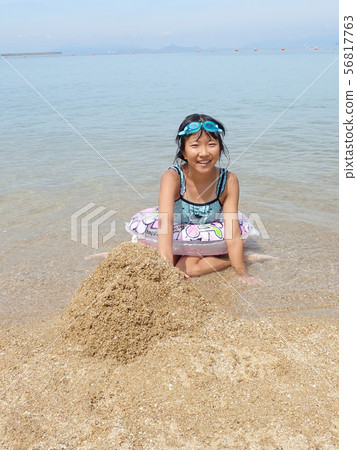 A girl who enjoys swimming 56817763