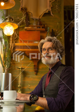 Man working on his project in a cafe. 56817831
