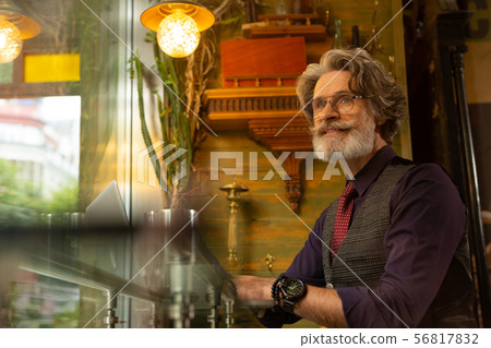 Thoughtful man sitting in the coffee shop. 56817832