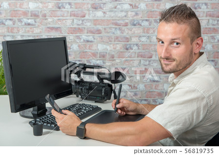 man video editor using graphic tablet 56819735