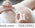 Pregnant women with positive result pregnancy test 56819962