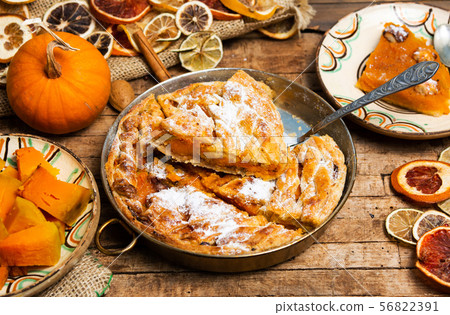 Homemade pumpkin pie with various ingredients 56822391