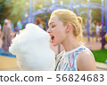 Young Woman With Cotton Candy 56824683