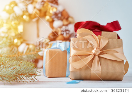 Christmas gift box with ribbon and decorations 56825174