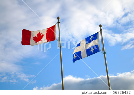 quebec canada flags waving in blue sky national quebec canada flags waving in blue sky national 56826422