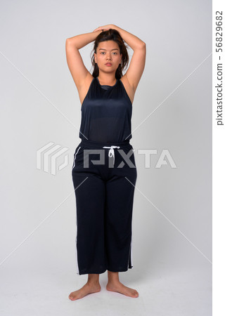 Full body shot of young beautiful Asian woman standing Full body shot of young beautiful Asian woman standing 56829682