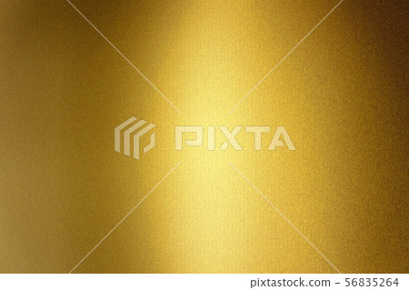 Light shining on gold metallic foil wall, abstract 56835264