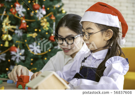 Happy family mother and child daughter playing toy Happy family mother and child daughter playing toy 56837608