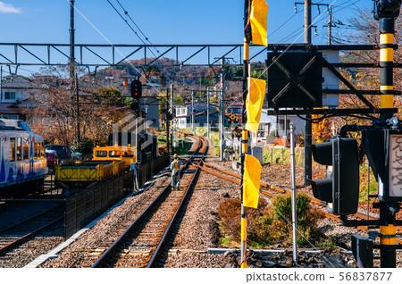 Train railway tracks junction with traffic light 56837877