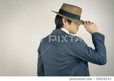 Young Asian Portrait Businessman Touch Hat at Back Young Asian Portrait Businessman Touch Hat at Back 56838243