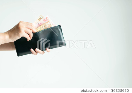 Hands picking Dollars Hong Kong money from wallet. Hands picking Dollars Hong Kong money from wallet. 56838650