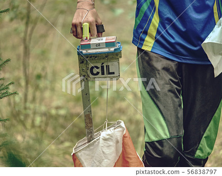 Person run to check point. Outdoor orienteering 56838797