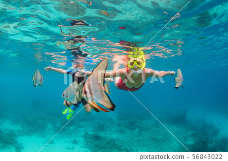 Mother, kid in snorkeling mask dive underwater 56843022