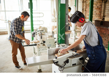 Workers Using Woodworking Machines Workers Using Woodworking Machines 56843088