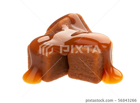 Caramel candies and caramel sauce isolated on white background 56843266