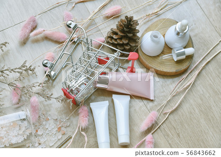 Cosmetic bottle container in shopping cart, Beauty 56843662