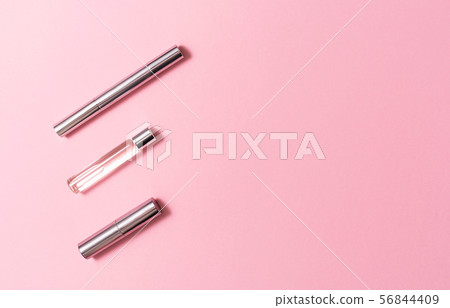 Flat lay composition with decorative makeup products and parfume on pink background. Makeup and Flat lay composition with decorative makeup products and parfume on pink background. Makeup and 56844409