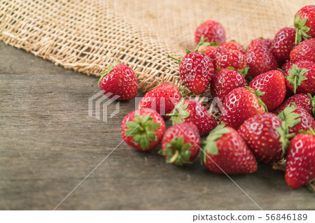 Strawberry fruit on wood table Strawberry fruit on wood table 56846189