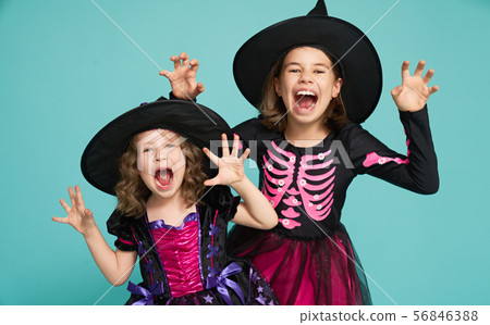 little witches on turquoise background. 56846388