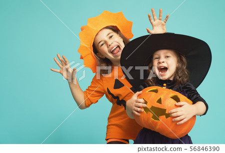 little witch and pumpkin on turquoise background 56846390