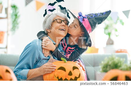 family celebrating Halloween family celebrating Halloween 56846463