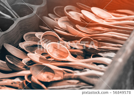 Many large wooden spoons 56849578