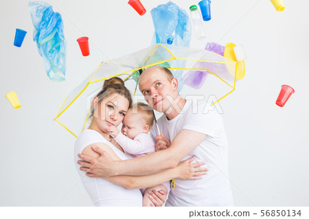 Environmental pollution, plastic recycling problem and ecology problem concept - sad family under 56850134