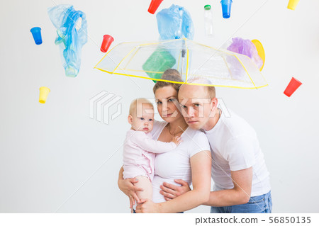 World Environment Day, plastic recycling problem and environmental disaster concept - Sad family 56850135