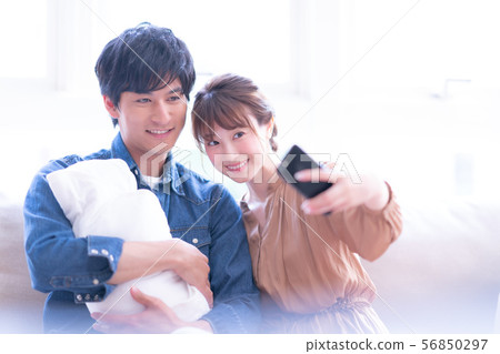 Lifestyle couple newlywed male female daytime man woman natural light baby parenting indoor infant young childcare Lifestyle couple newlywed male female daytime man woman natural light baby parenting indoor infant young childcare 56850297