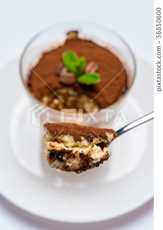 Spoon full of Classic tiramisu dessert on white background with clipping path Spoon full of Classic tiramisu dessert on white background with clipping path 56850600