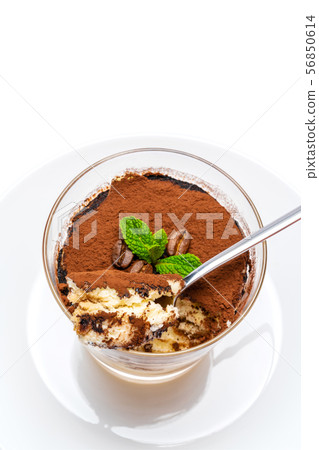 Classic tiramisu dessert in a glass cup on the plate on white background with clipping path Classic tiramisu dessert in a glass cup on the plate on white background with clipping path 56850614