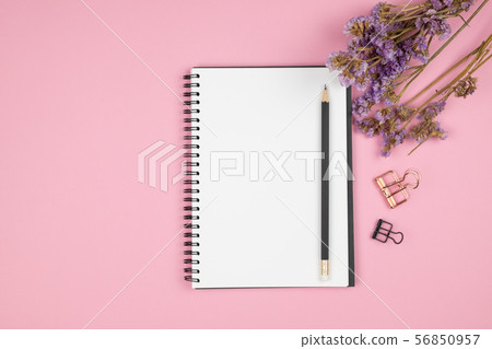 Top view of notebook and purple flower Top view of notebook and purple flower 56850957