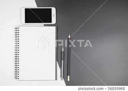 Top view of open notebook with stationery 56850968