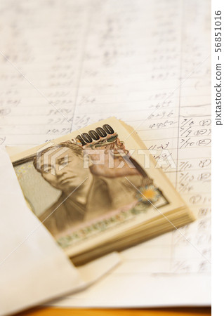 Handwritten household account book and Japanese money 56851016