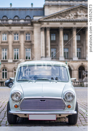 Old looking car in front of the Official Royal 56852673