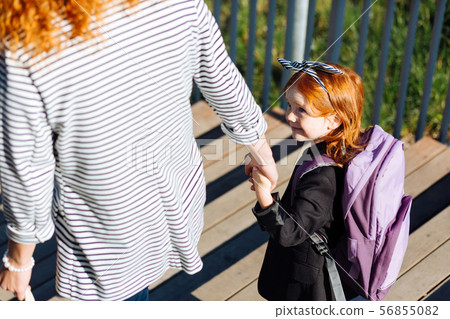 Close up of cheerful pupil that looking at mother 56855082