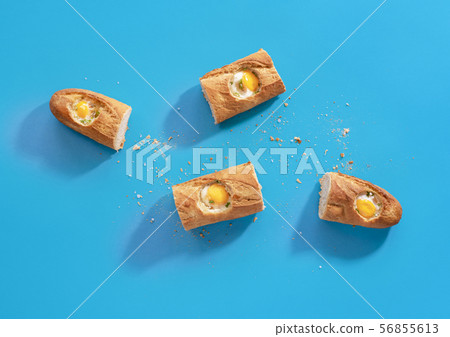 Breakfast with eggs in bread on blue tabletop 56855613