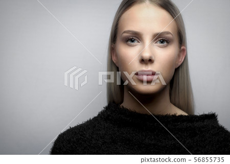 Portrait of a young blonde woman with fury jacket Portrait of a young blonde woman with fury jacket 56855735